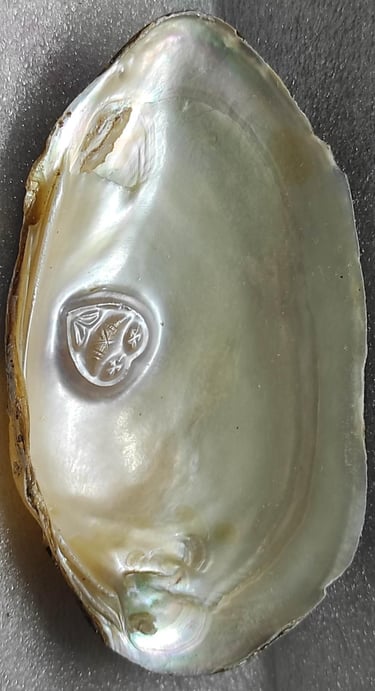 "11mm white cultured pearl with engraved heart motif–using nucleus technique-for overseas demand"