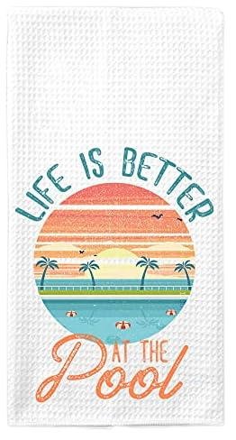 White waffle weave kitchen towel featuring a tropical pool sunset and Life is Better at the Pool text.