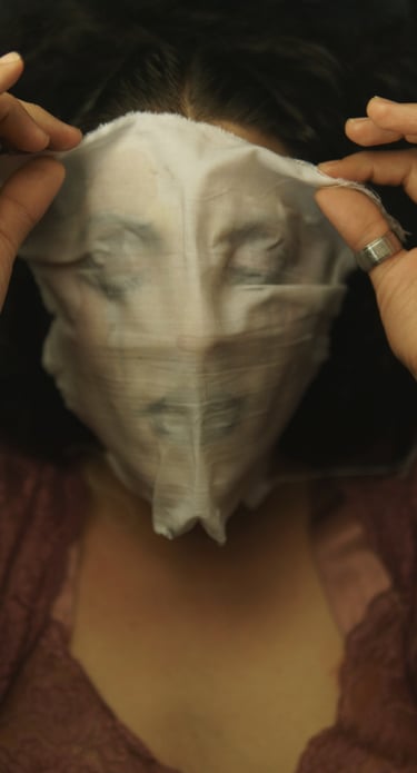 a woman with a mask covering her face with with a pieace of white fabric