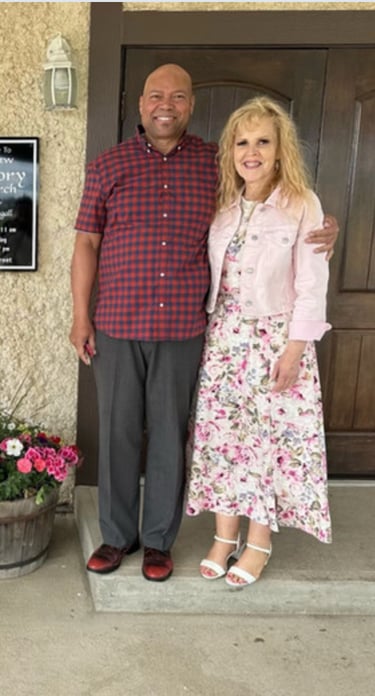 Pastors Brian and Alexis standing in front of Valleyview Victory Church.