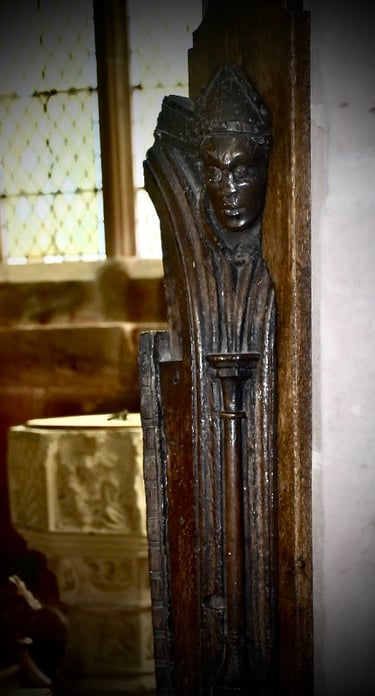photograph of a wood carving of a man. 