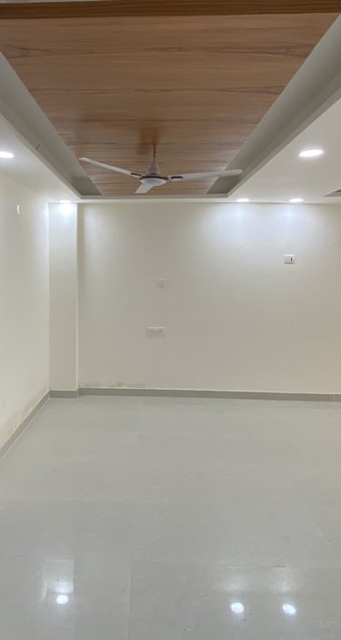 Spacious Living Room of 3 BHK Corner Builder Floor with Multiple Balconies — Chattarpur