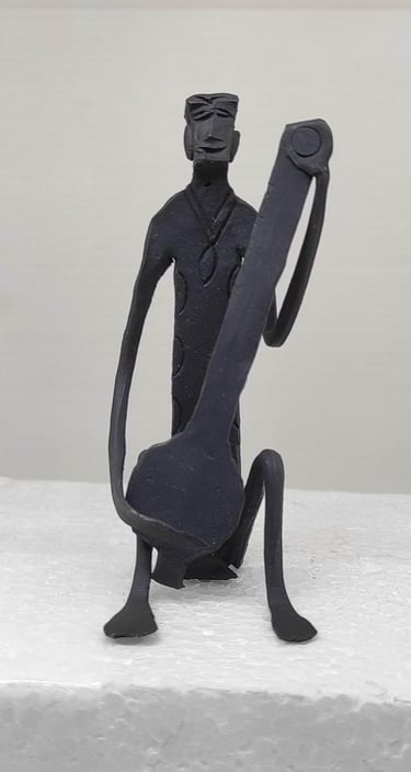 "Handcrafted iron tribal man playing Tanpura–sitting view-for export"