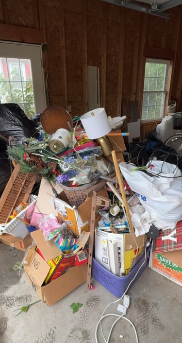 Garage debris before junk removal cleanout service