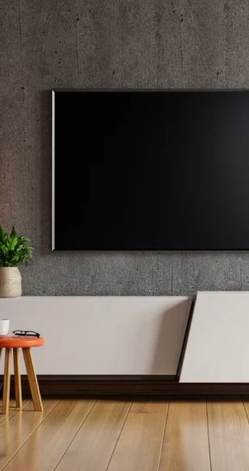 tv mounted on concrete wall