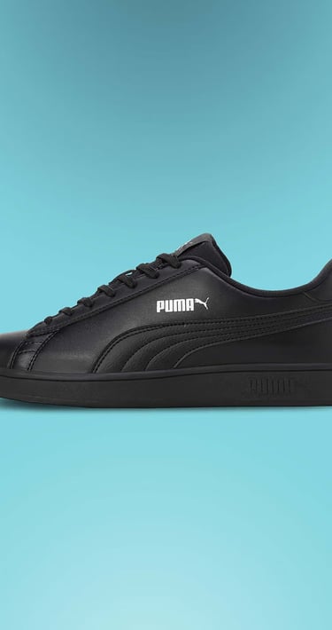 Side view of a black Puma Smash v2 leather sneaker for men featuring classic lace-up design.