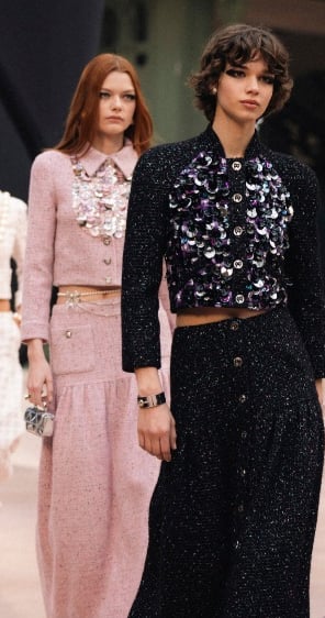Chanel Fall/Winter 2025–2026 models walking finale in pastel tweeds and statement knits.