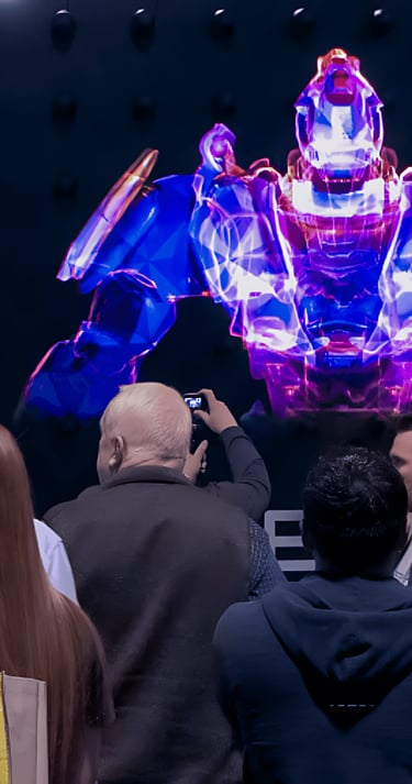 a man taking a picture of a giant robot