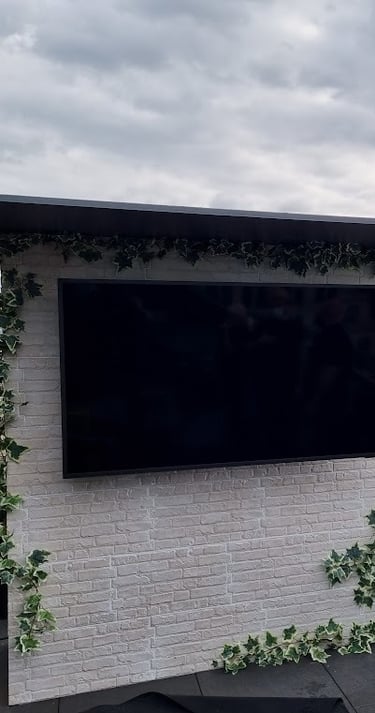 Professional installation of a Samsung Terrace outdoor TV on a luxury balcony overlooking the London