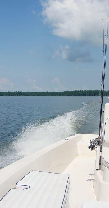 Captain Lee at the helm in Weeks Bay Alabama