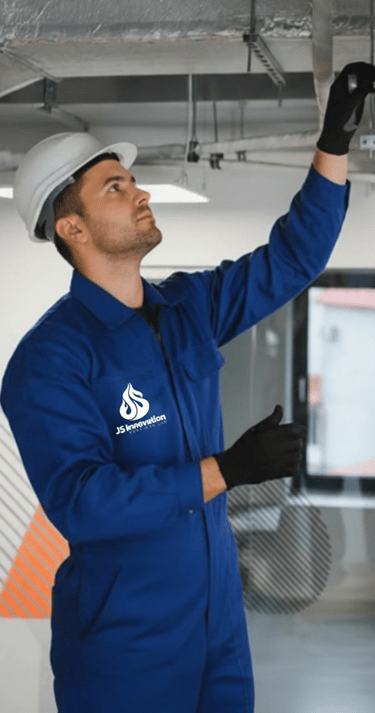 HVAC technician inspecting ventilation system and performing technical diagnostics on air duct insta