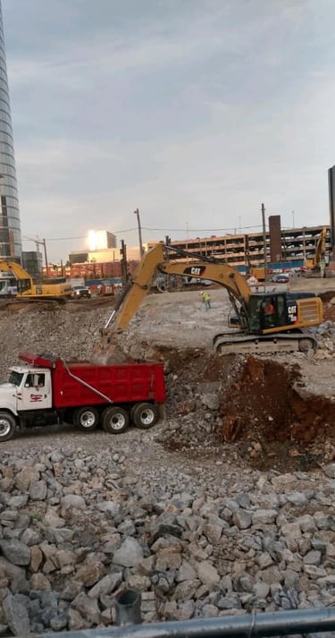 Dump truck and excavator, excavation, excavating, hauling