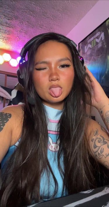 A woman in gaming headphones and a cosplay