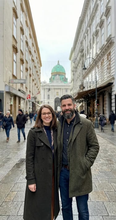 Couple exploring Vienna city center with St. Michael’s Church in the background.