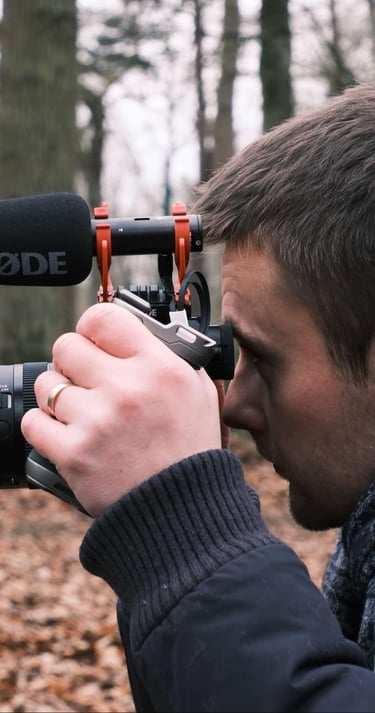 a man is taking a photo of a camera and recording a video camera
