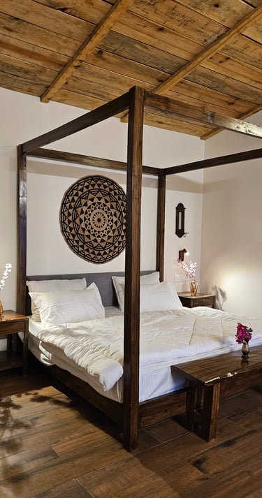 King bed with forest view at ilika Resorts, Uttarakhand