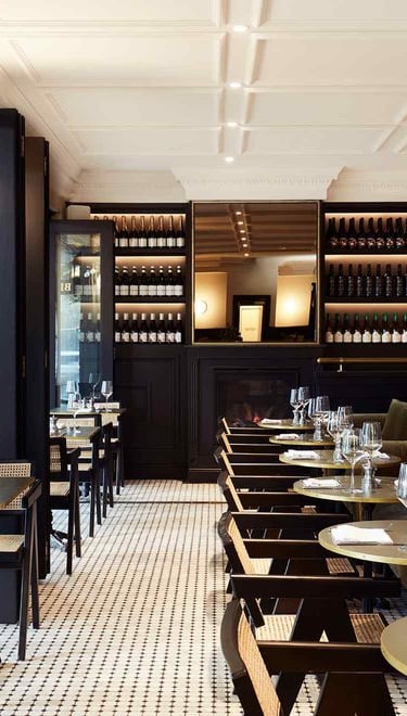 a restaurant with a long table and chairs