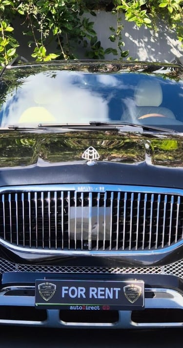 Front view of a black Mercedes-Benz Maybach luxury SUV for rent, featuring a chrome grille.