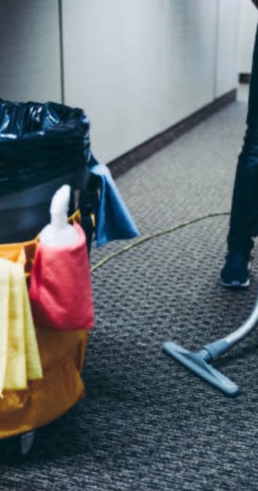 CoreBright vacuuming carpet.