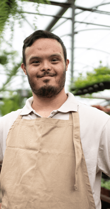 Disabled Adult Male in a greenhouse