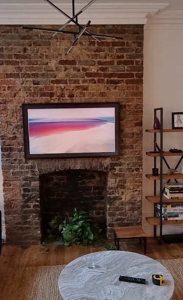 Professional TV wall mounting with hidden cabling in a London residential living room