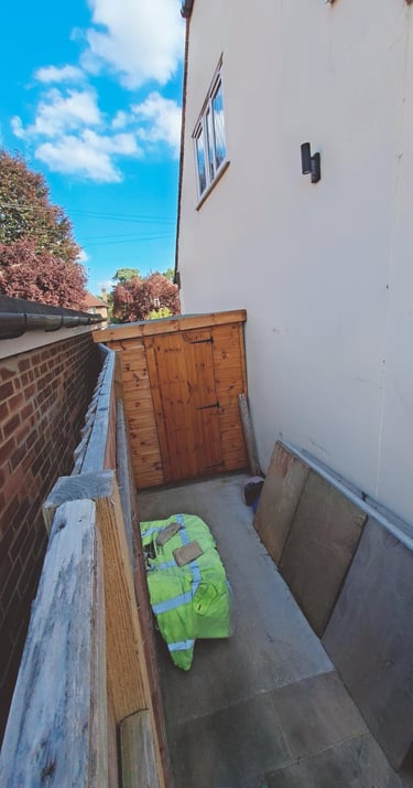 www.truthincontext.co.uk Paving intact in space between both houses. View is towards the street.
