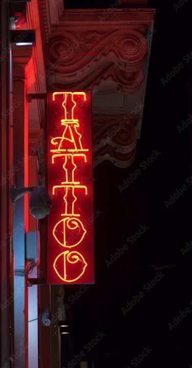 Image showing a neon sign with Tattoo