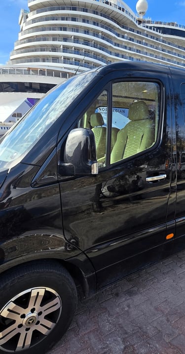 Private shore excursion van picking up cruise passengers at Tourlos New Port Mykonos.