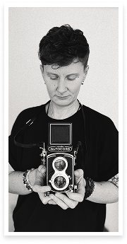 Portrait of the photographer Kaisa Tiits using analogue medium format camera Minolta Autocord.