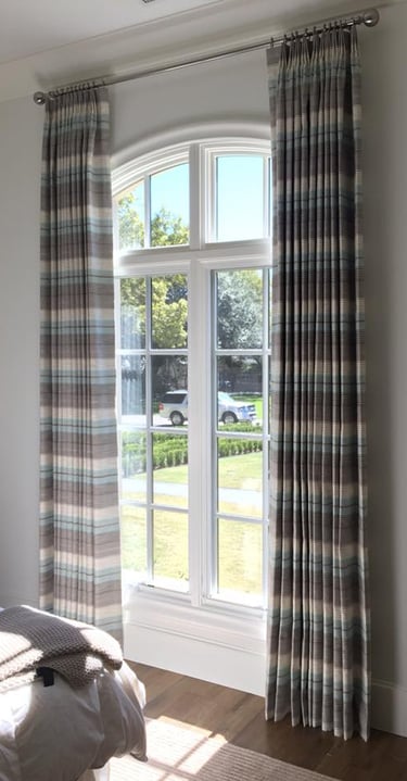 Custom Drapery Panels with horizontal stripe designer fabric on custom rod