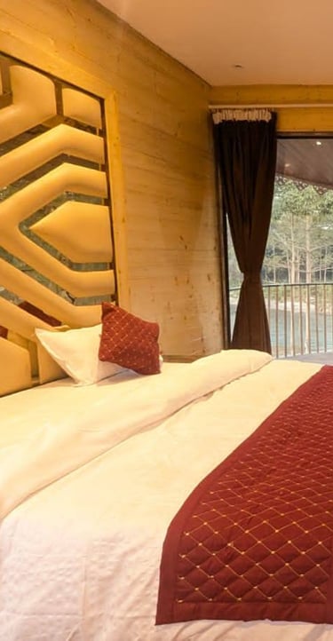 a bedroom with a bed and a television