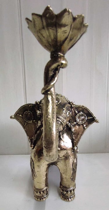 "Handcrafted brass elephant holding lotus flower in raised trunk, front side-Export-grade"