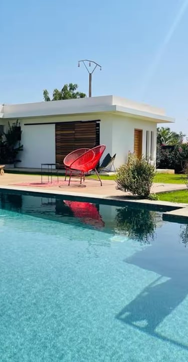 a pool with a red chair and a red chair