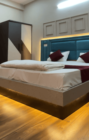 a bed with a large bed and a large bed,Shikohabad best hotel