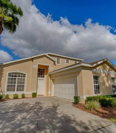 a Florida villa home with a palm tree