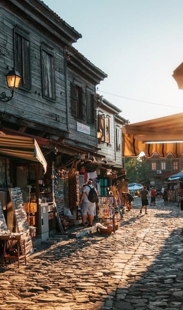 a street scene with a cobblestone road and a cobblestone road