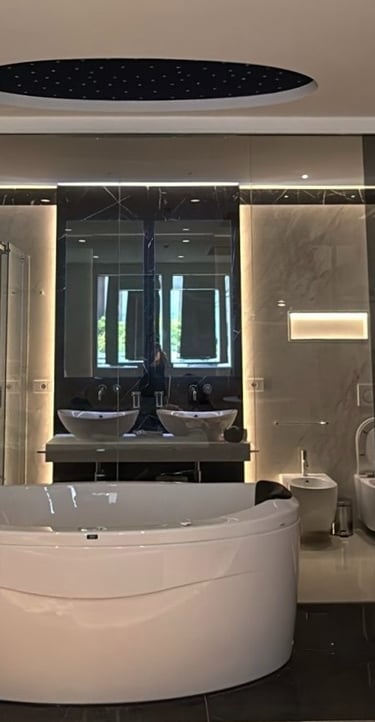 a bathroom with a large tub and a large tub