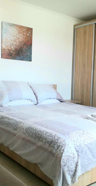 a bedroom with a bed and a desk