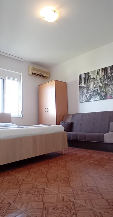 a bedroom with a couch and a couch