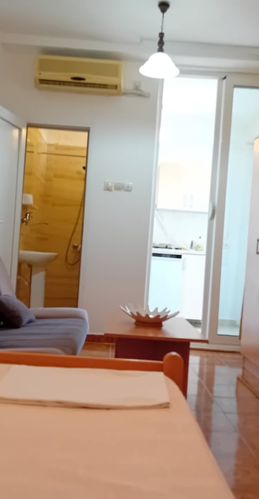 a bedroom with a chair and a couch