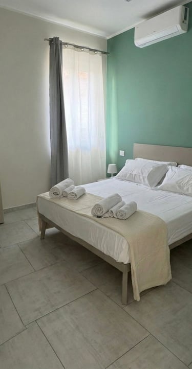 domus casa vacanze stanza da letto