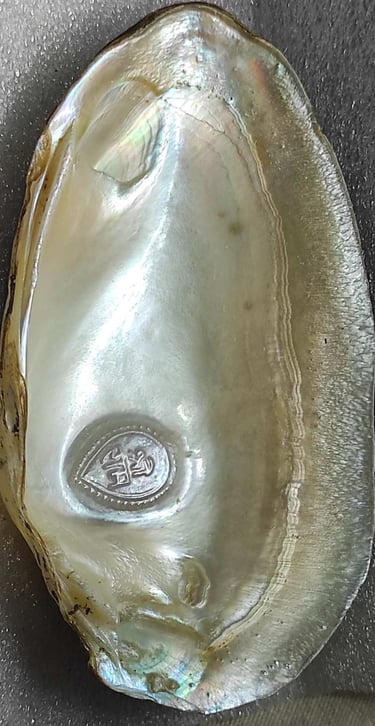 "11mm white designer cultured pearl with a divine face motif–crafted using nucleus technique-for global buyers"
