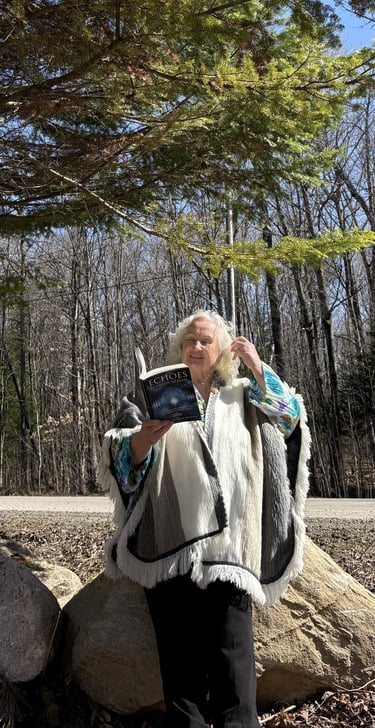 Tammie Whalen Buckler holding book, "Echoes Between Realms"
