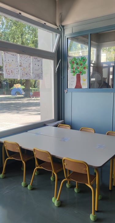 a table with chairs and a table with a vase on it