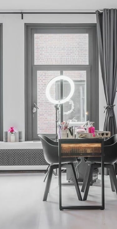 a living room with a dining table and chairs