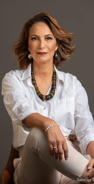 a corporate woman in a white shirt and a necklace