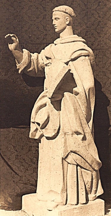 a statue of a man holding a hat