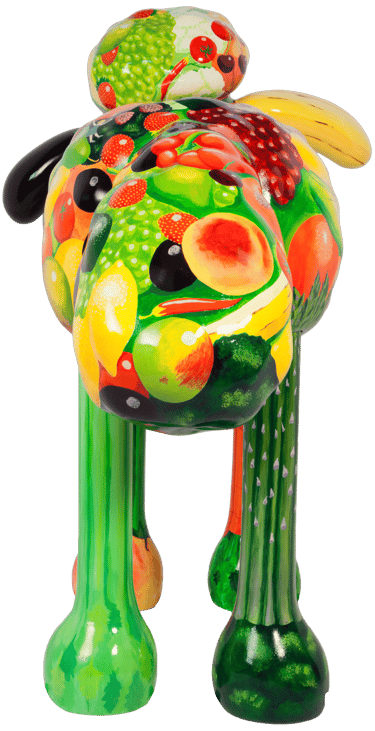 A large street sculpture od Shaun the Sheep painted with fruit and vegetables.