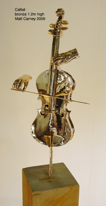 a bronze sculpture of hands playing a cello