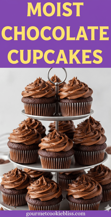 A three-tiered silver stand overflowing with moist chocolate cupcakes, each topped with dark chocola